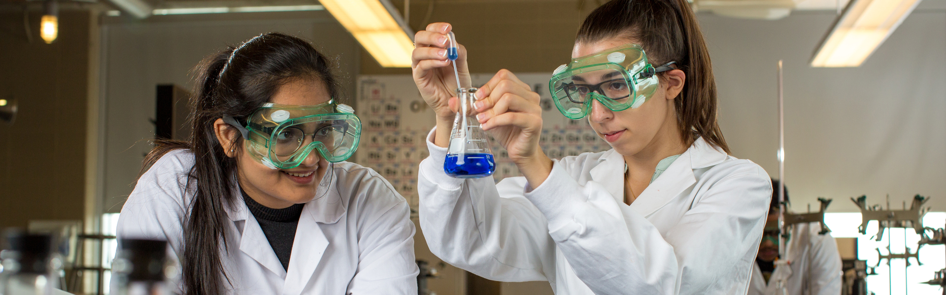 Students in a lab working with chemicals