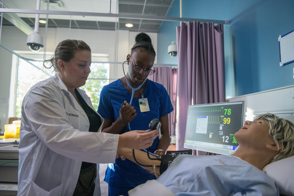 Nursing students in a clinical environment.