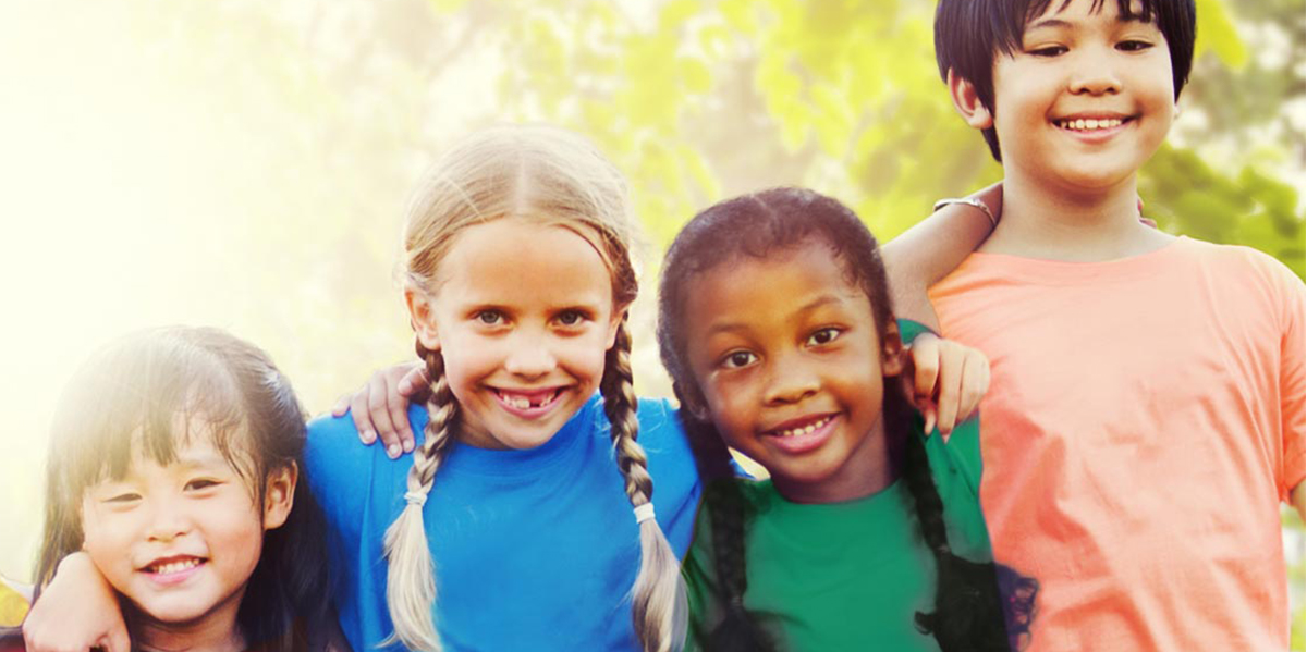 kids smiling at the camera